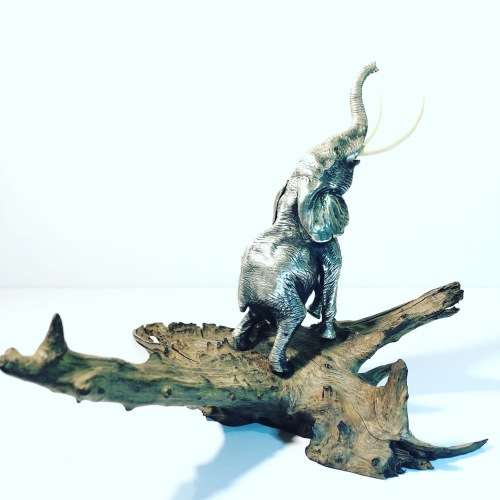 A PATRICK MAVROS SOLID HALLMARKED SILVER ELEPHANT ON WOODEN BASE