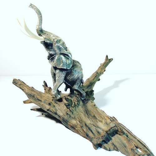 A PATRICK MAVROS SOLID HALLMARKED SILVER ELEPHANT ON WOODEN BASE