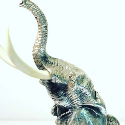 A PATRICK MAVROS SOLID HALLMARKED SILVER ELEPHANT ON WOODEN BASE