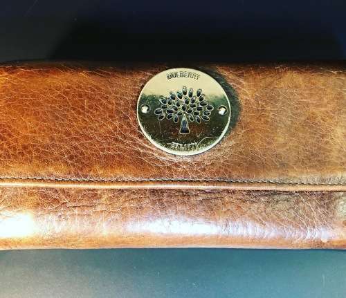 A PREOWNED LADIES MULBERRY CRAFTED LEATHER PURSE