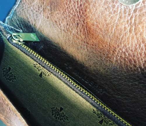 A PREOWNED LADIES MULBERRY CRAFTED LEATHER PURSE