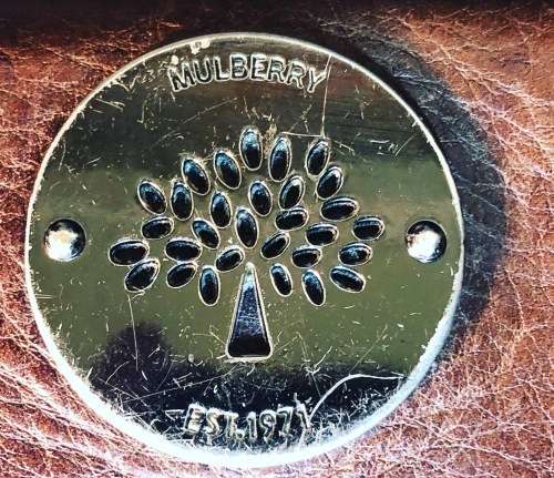 A PREOWNED LADIES MULBERRY CRAFTED LEATHER PURSE