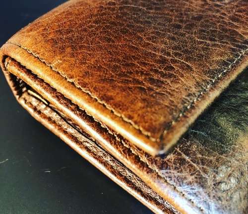 A PREOWNED LADIES MULBERRY CRAFTED LEATHER PURSE