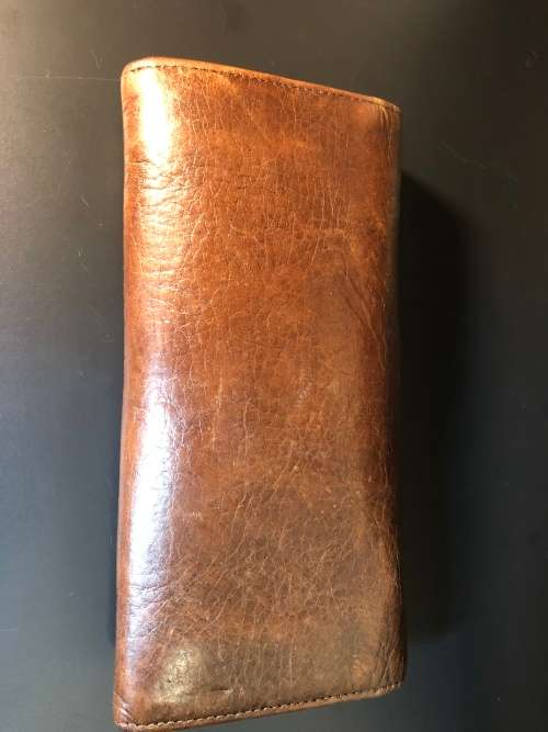 A PREOWNED LADIES MULBERRY CRAFTED LEATHER PURSE