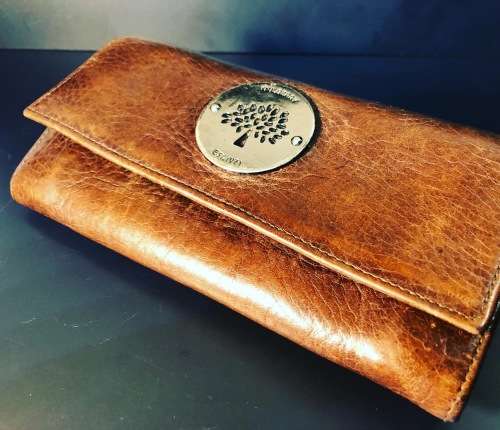 A PREOWNED LADIES MULBERRY CRAFTED LEATHER PURSE