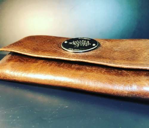 A PREOWNED LADIES MULBERRY CRAFTED LEATHER PURSE