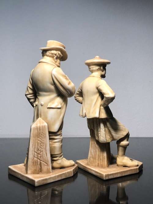 A PAIR OF ROYAL WORCESTER HADLEY COUNTRIES OF THE WORLD FIGURINES