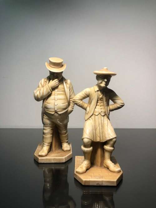 A PAIR OF ROYAL WORCESTER HADLEY COUNTRIES OF THE WORLD FIGURINES