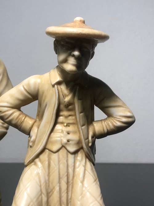 A PAIR OF ROYAL WORCESTER HADLEY COUNTRIES OF THE WORLD FIGURINES