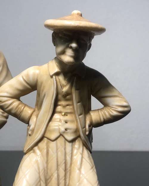 A PAIR OF ROYAL WORCESTER HADLEY COUNTRIES OF THE WORLD FIGURINES