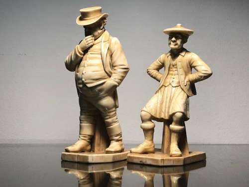 A PAIR OF ROYAL WORCESTER HADLEY COUNTRIES OF THE WORLD FIGURINES