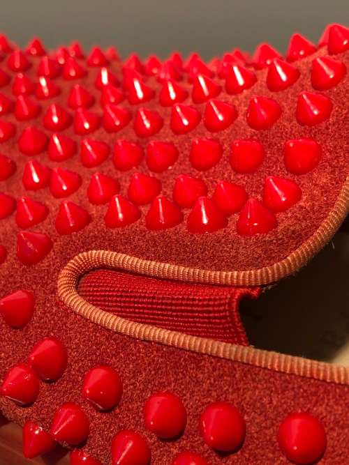 A Pair of Second Hand Christian Louboutin Red Spike Boat Shoes size 8.5