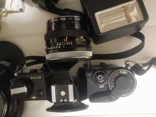 Rare Black Canon AE1 35mm SLR Film Camera Black camera with 4 lenses.