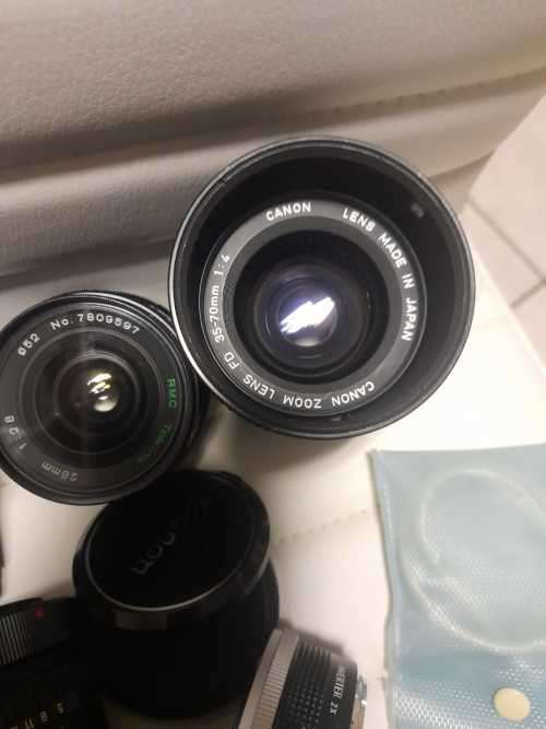 Rare Black Canon AE1 35mm SLR Film Camera Black camera with 4 lenses.