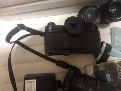 Rare Black Canon AE1 35mm SLR Film Camera Black camera with 4 lenses.