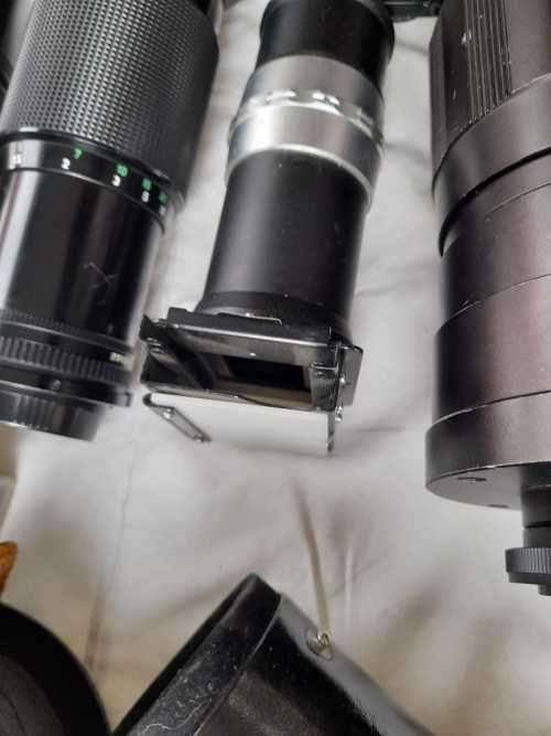 The last one Rare all Black Canon AE1 35mm SLR Film Camera Black camera with 6 lenses.