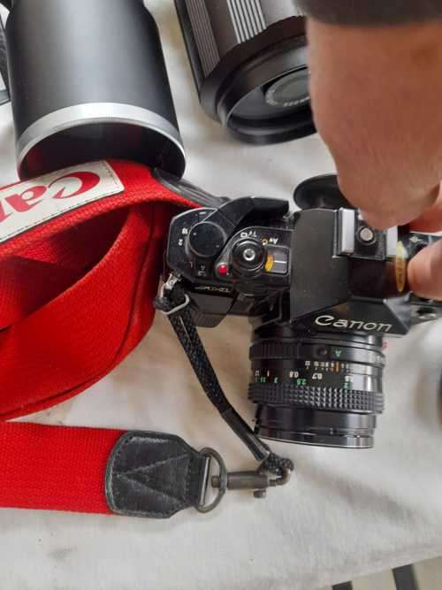 The last one Rare all Black Canon AE1 35mm SLR Film Camera Black camera with 6 lenses.