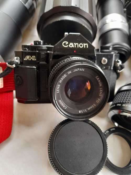 The last one Rare all Black Canon AE1 35mm SLR Film Camera Black camera with 6 lenses.