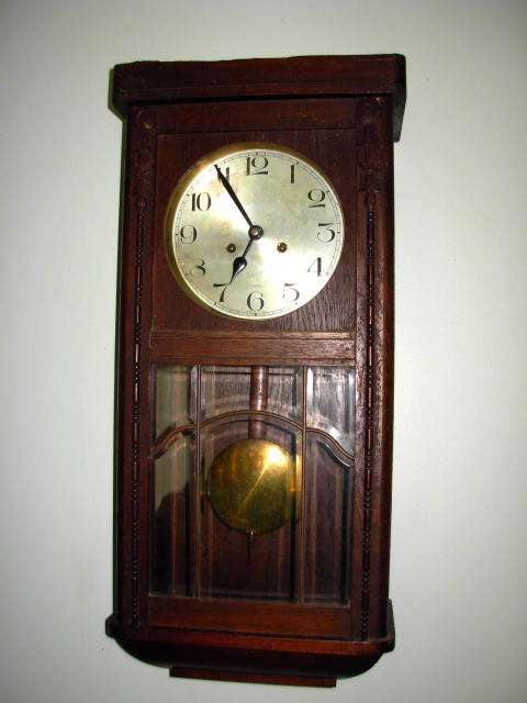 A 90 YEAR  OLD  Edwardian oak cased WALL CLOCK, the silvered dial with Arabic numerals. in the 1920