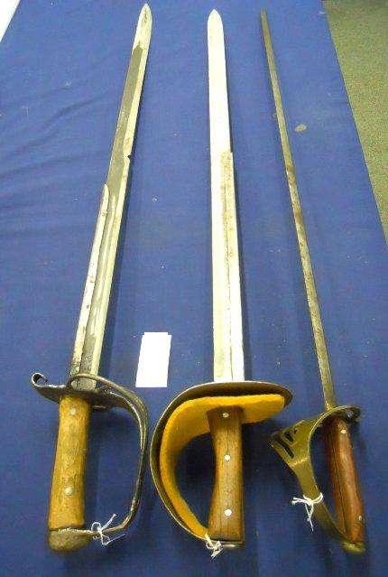 Two Crude SWORDS and a boy's SWORD. shipping will be R60