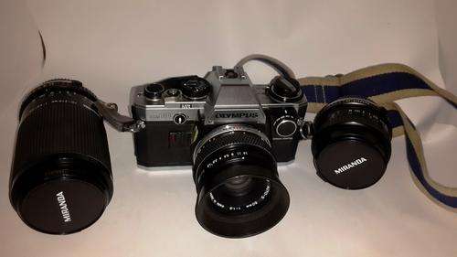 This auction is for nice Vintage Olympus OM 10 Camera. and Three lenses