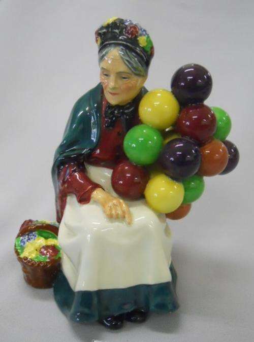 A Royal Doulton FIGURE, The Old Balloon Seller  19.1cm High