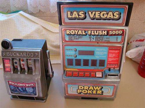 These are rare vintage Buckaroo miniature gambling machine22 by 14cm and a royal flush slot machine