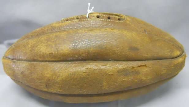 An early 20thC eight-panel leather RUGBY BALL