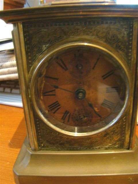 A French brass cased carriage clock with an handle top. A subsidiary alarm mechaSHIPPING WILL BE R40