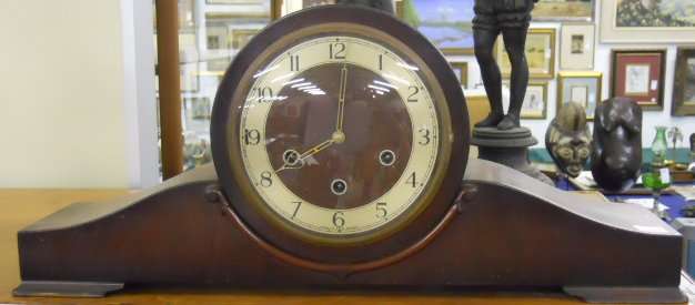 A 1950's walnut cased MANTLE CLOCK, 56cm wide .WORKING SHIPPING WILL BE R45