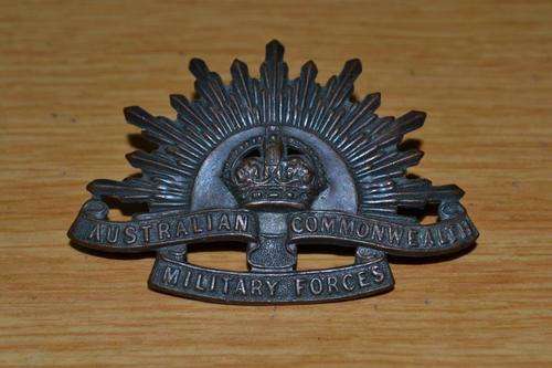 Australia Rising sun cap badge by Stokes and Son Melbourne.