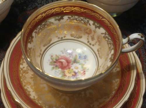 Elegant Royal Paragon floral sprig gold, pink and a maroon band Rococo-style Tea trio 1952-1956