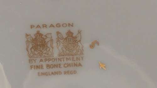 Elegant Royal Paragon floral sprig gold, pink and a maroon band Rococo-style Tea trio 1952-1956