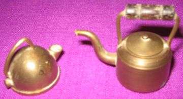 TWO BRASS KETTLE ORNAMENTS