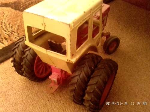 International tractor with plough, wagon and two cars