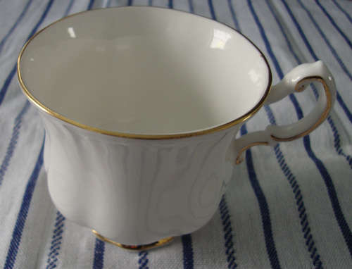 VINTAGE PARAGON TEA TRIO WITH GILT TRIM