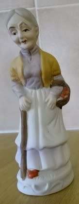 TWO BEAUTIFUL CERAMIC FIGURINES, THE OLD LADY AND THE SEAMSTRESS