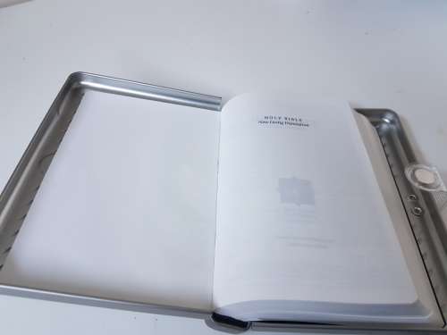 New bible in a solid metal box with magnetic clasp. New Living Translation.