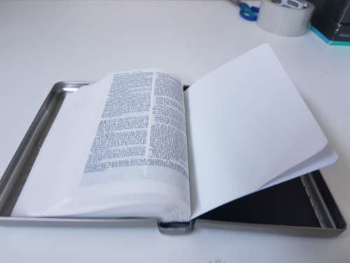 New bible in a solid metal box with magnetic clasp. New Living Translation.