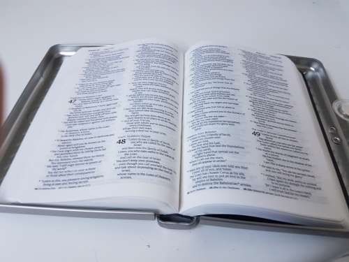 New bible in a solid metal box with magnetic clasp. New Living Translation.
