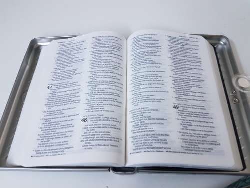 New bible in a solid metal box with magnetic clasp. New Living Translation.