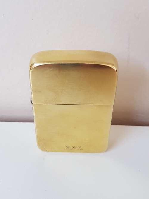 Excellent new condition. Zippo XXX lighter. Solid brass. Working.  Gold colour.