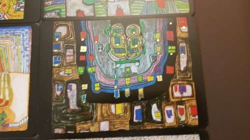 Friedensreich Hundertwasser (1928-2000). Collage of 15 Art Cards . Silver and Gold Imprints. Framed.