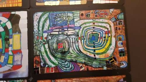 Friedensreich Hundertwasser (1928-2000). Collage of 15 Art Cards . Silver and Gold Imprints. Framed.
