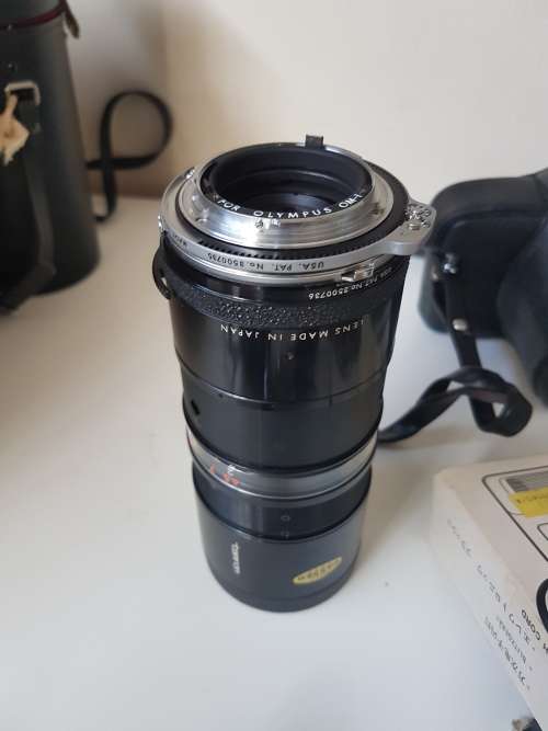 Olympus OM1 camera with lens, zoom lens, tripod, flash, cases, carrybag. Treasured possession.