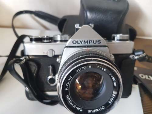 Olympus OM1 camera with lens, zoom lens, tripod, flash, cases, carrybag. Treasured possession.