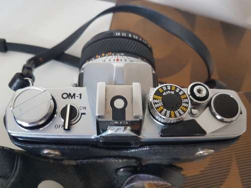 Olympus OM1 camera with lens, zoom lens, tripod, flash, cases, carrybag. Treasured possession.