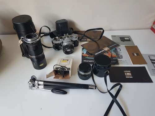 Olympus OM1 camera with lens, zoom lens, tripod, flash, cases, carrybag. Treasured possession.