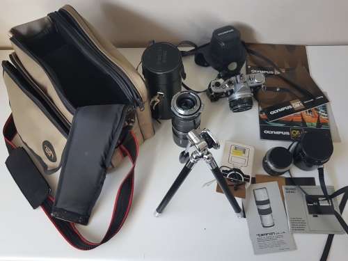Olympus OM1 camera with lens, zoom lens, tripod, flash, cases, carrybag. Treasured possession.