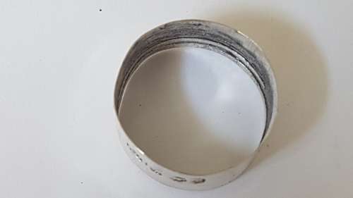 Solid sterling silver hallmarked ring.  Made from vintage bottle lid.